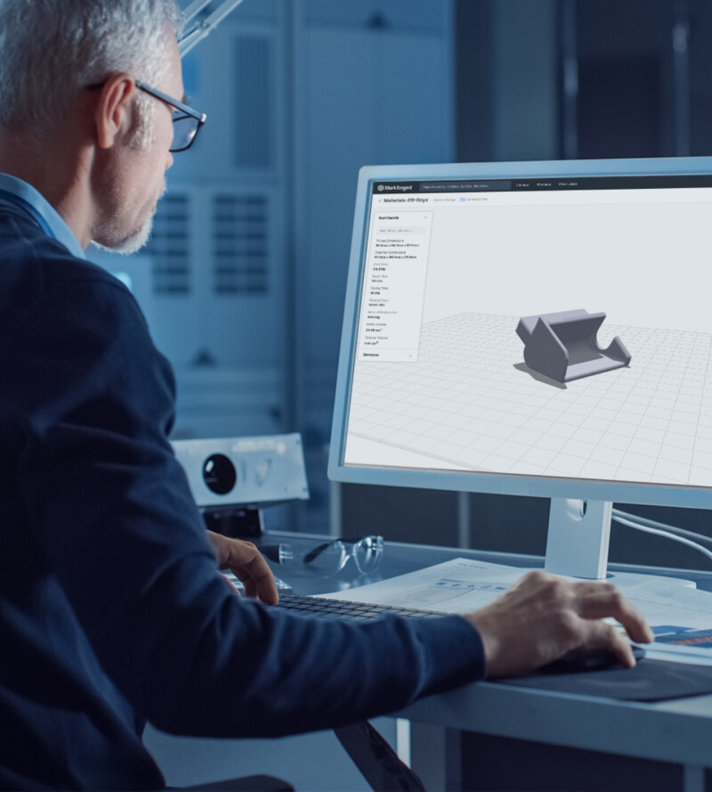 Engineer looking at Markforged's 3D printer software, Eiger