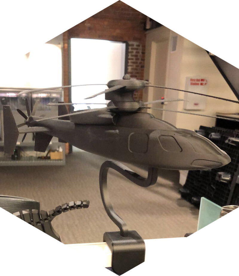 3D printed helicopter on an employees desk